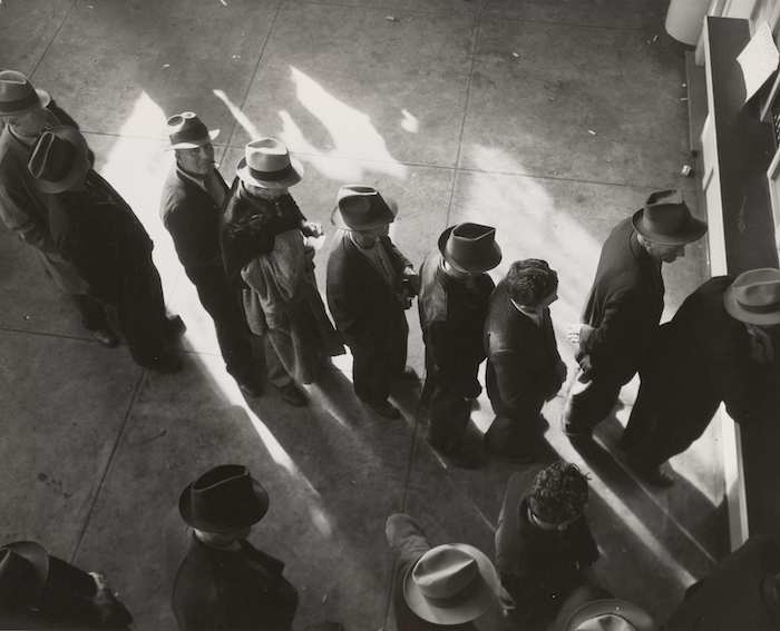 People lined up to receive unemployment benefits