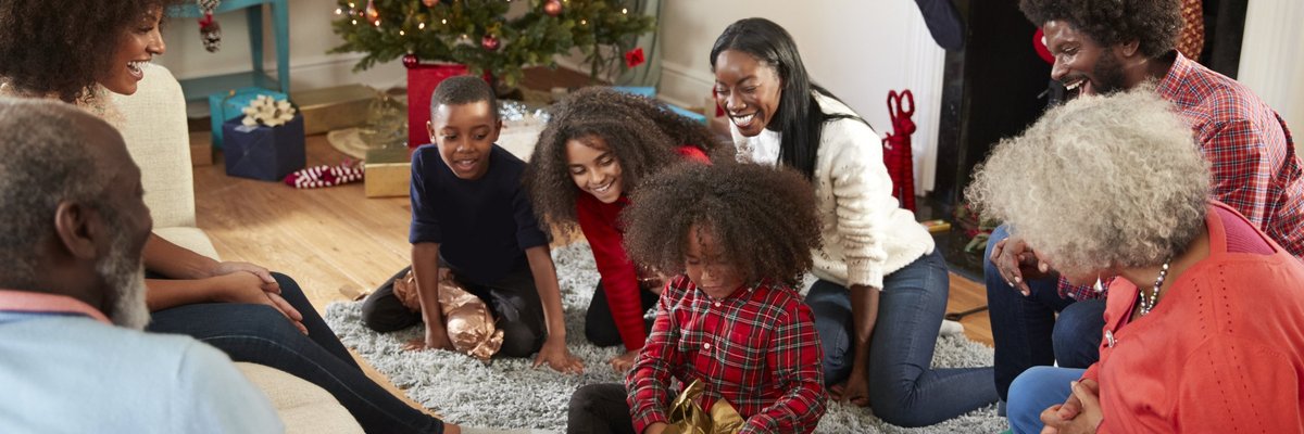 A family opening gifts on Christmas morning.