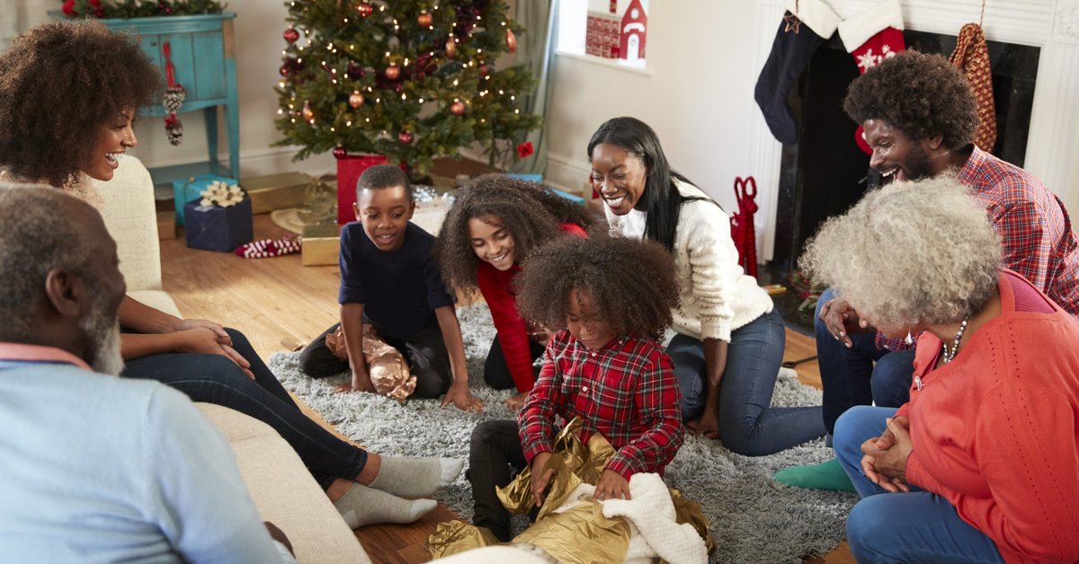 A family opening gifts on Christmas morning.