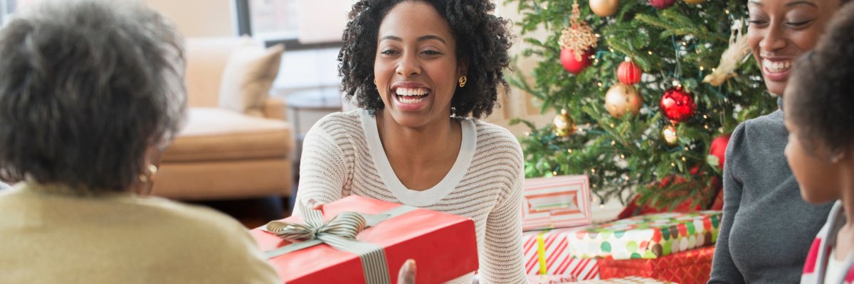 Family passing around Christmas gifts