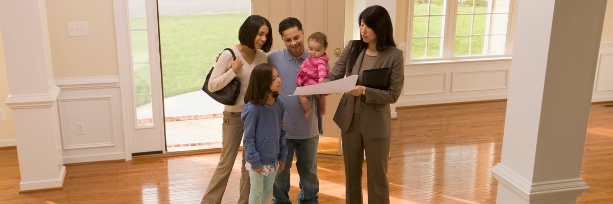 Family touring home with realtor.