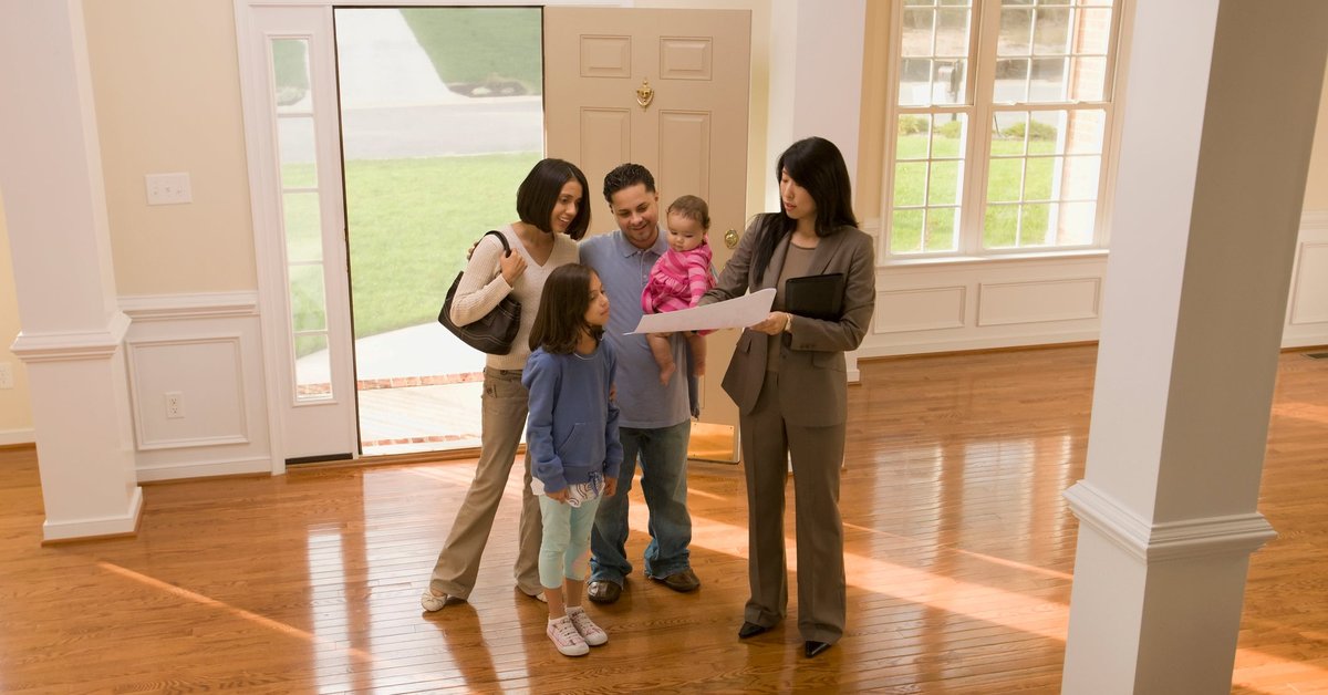 Family touring home with realtor.