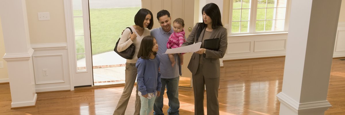 Family touring home with realtor.