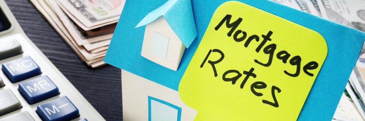 "Rates" on a stick note on a house