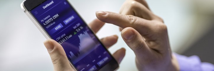 A woman buys cryptocurrency through a mobile phone app.