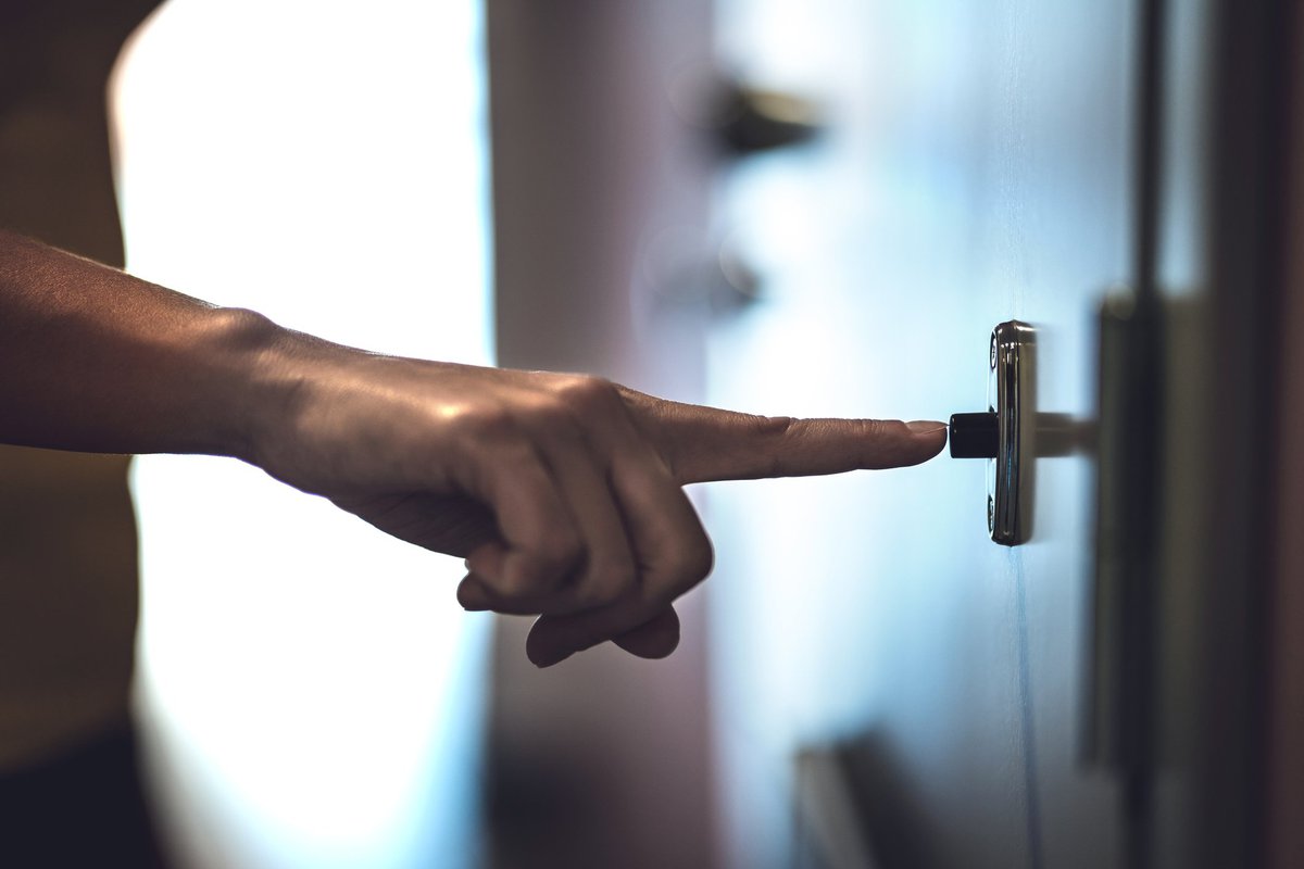 Finger ringing doorbell.