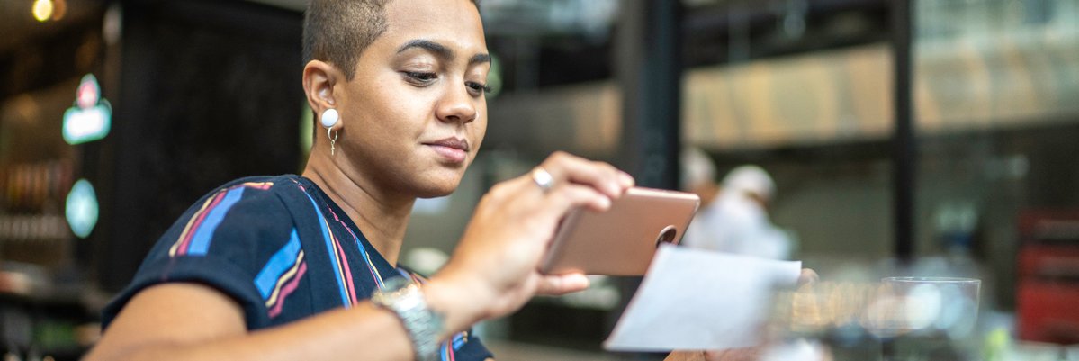 Person making a mobile check deposit.