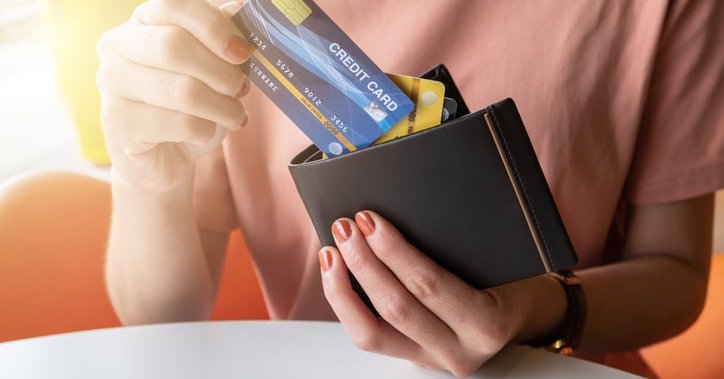 Close up on wallet containing various credit cards.