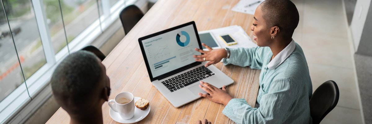 Financial advisor discusses credit scores with a client.