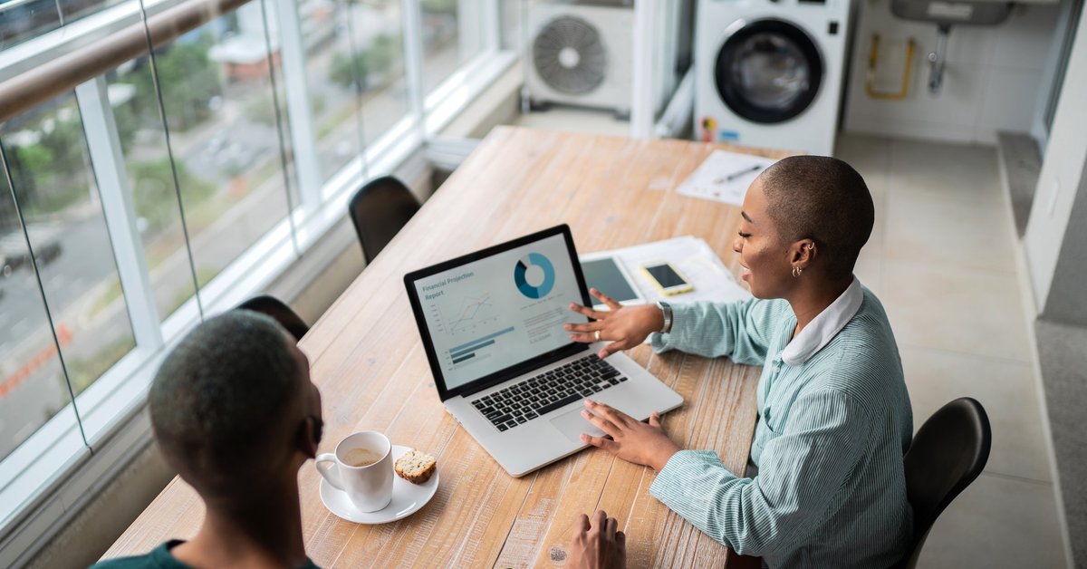 Financial advisor discusses credit scores with a client.