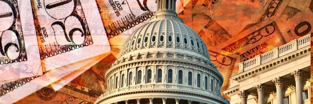 U.S. Capitol building with fifty dollar bills in the background.