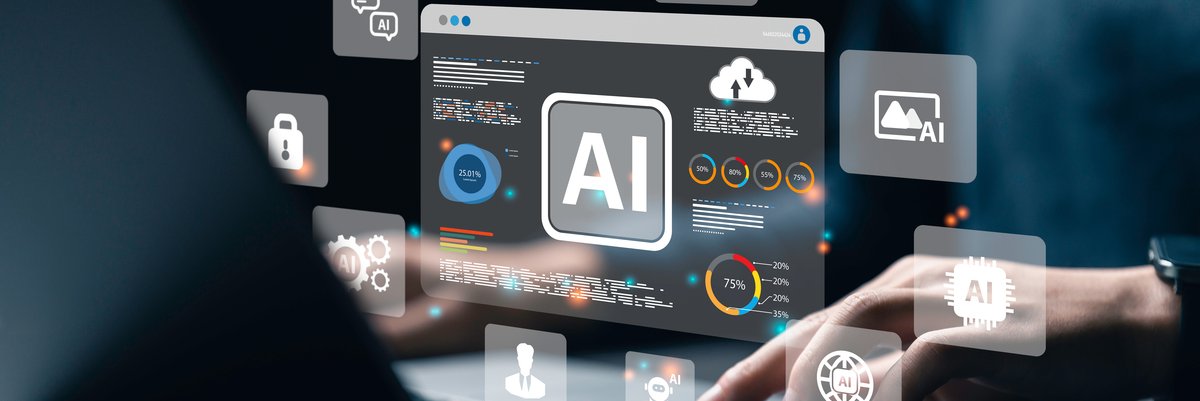 Person uses laptop with AI and associated symbols showing in the air above the keyboard.