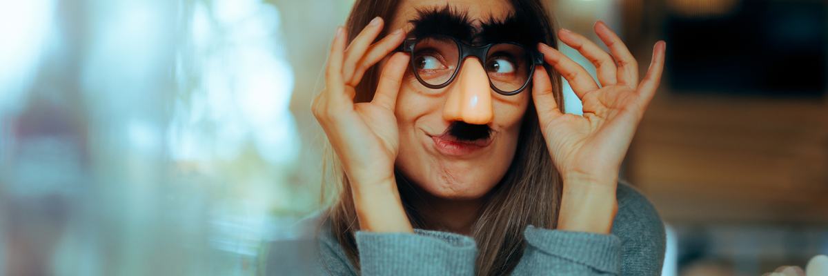 Woman wearing funny disguise glasses.