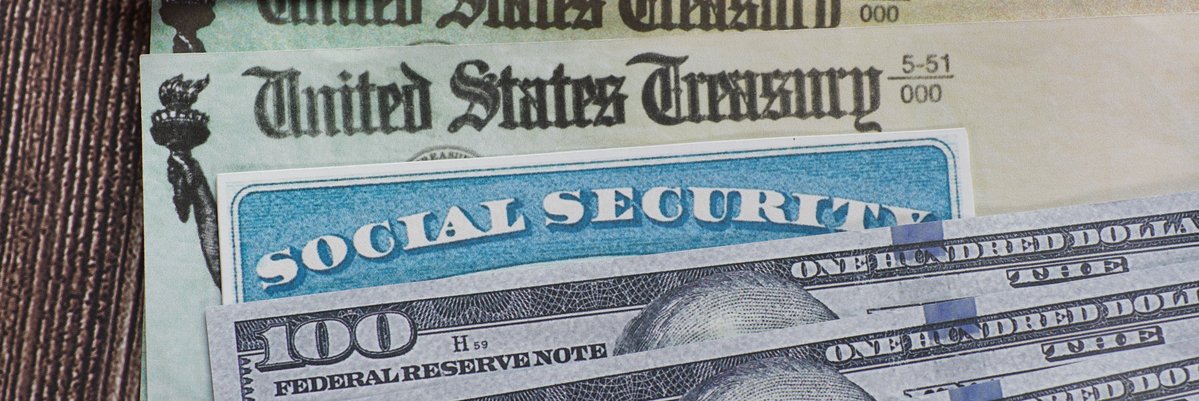 Social security checks, a social security card, and three hundred dollar bills.