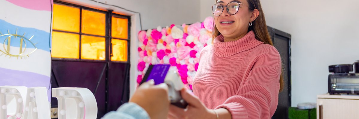 Person paying with credit card at small business.