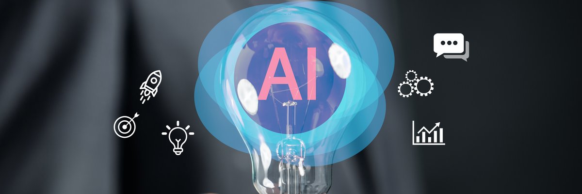 "AI" inside lightbulb being held by human hand with other small image depictions surrounding it.