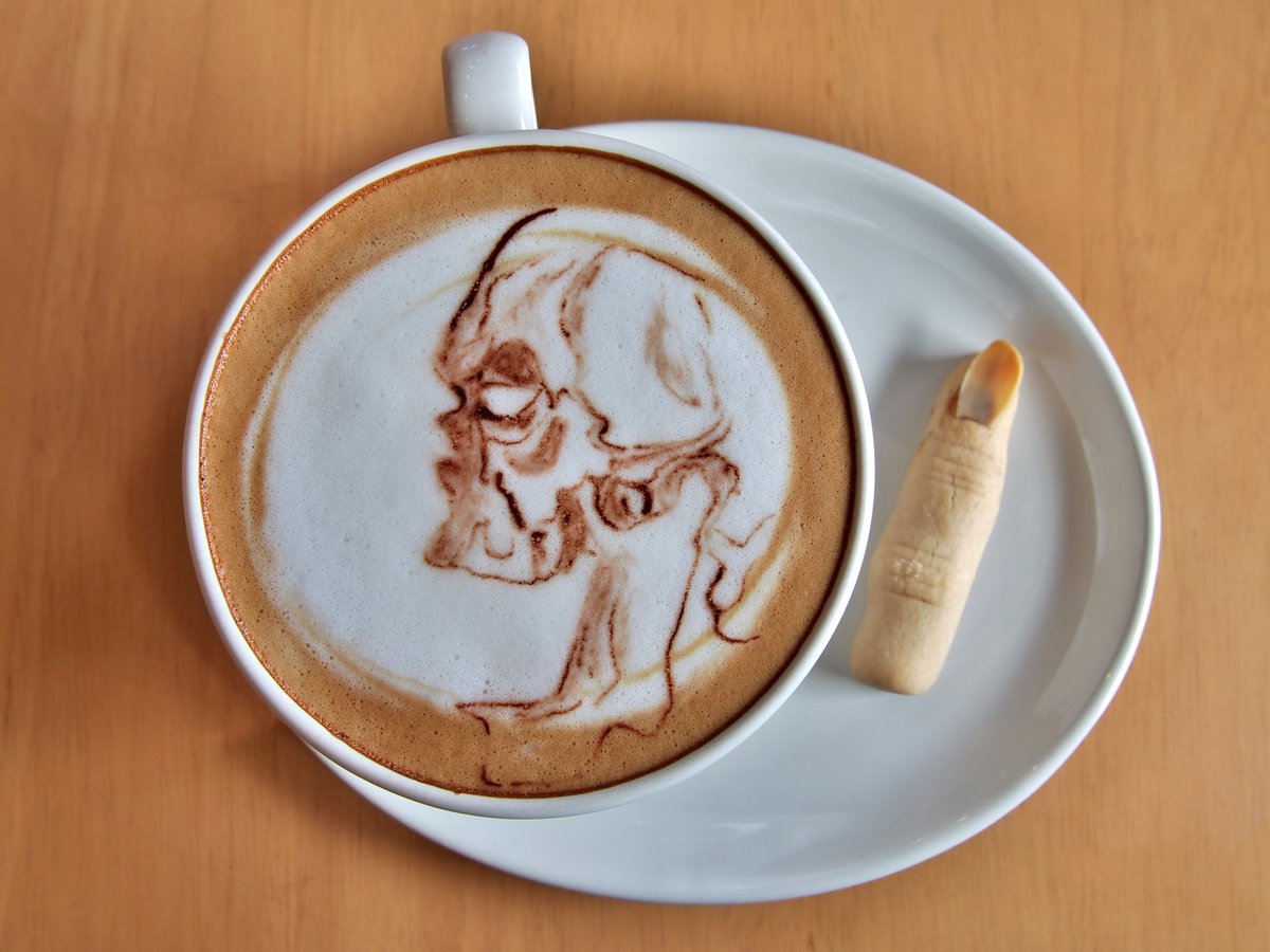 Face of a boogeyman in latte art.