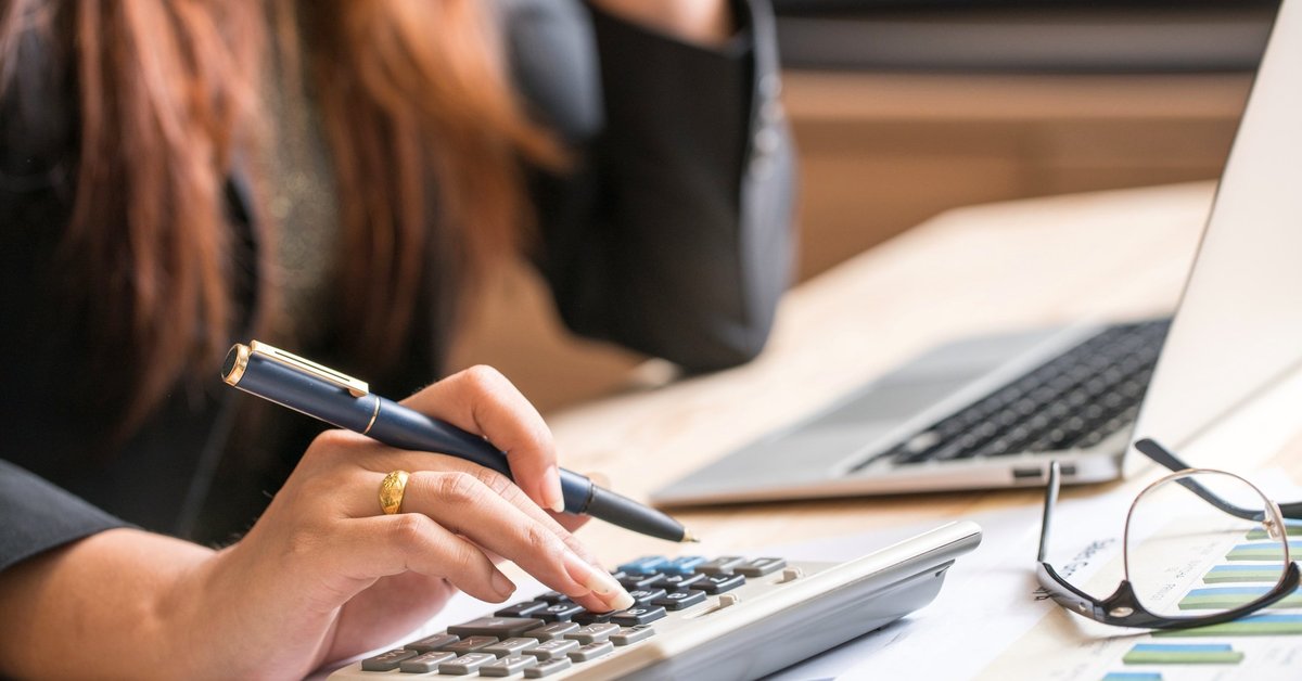 Woman making calculations at her computer