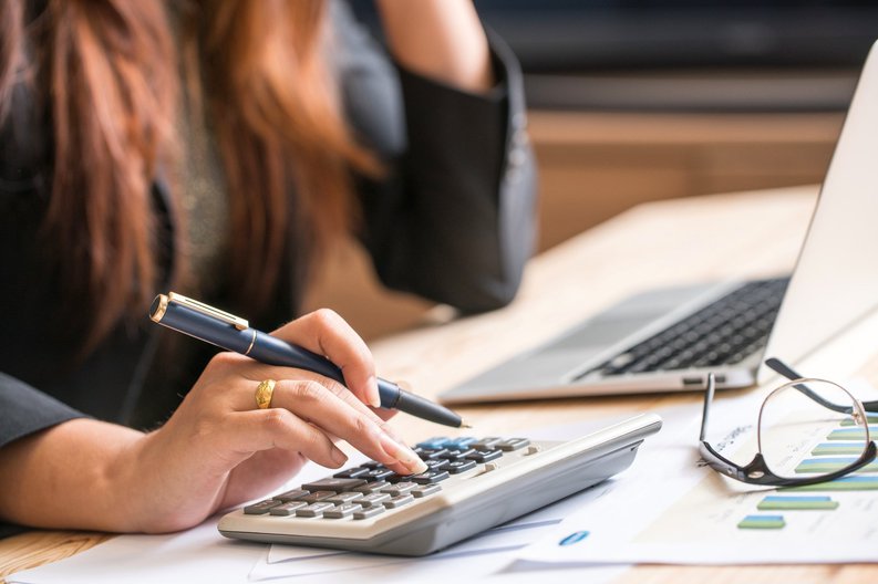 Woman making calculations at her computer