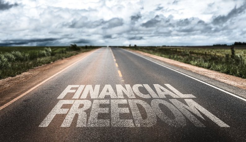 Road with the words "financial freedom" painted on it