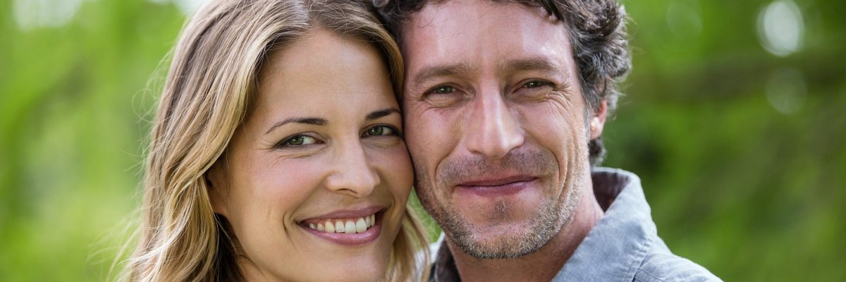 Smiling man and woman in their 40s