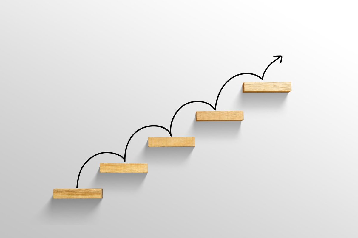 Arrow moving up wood stairs
