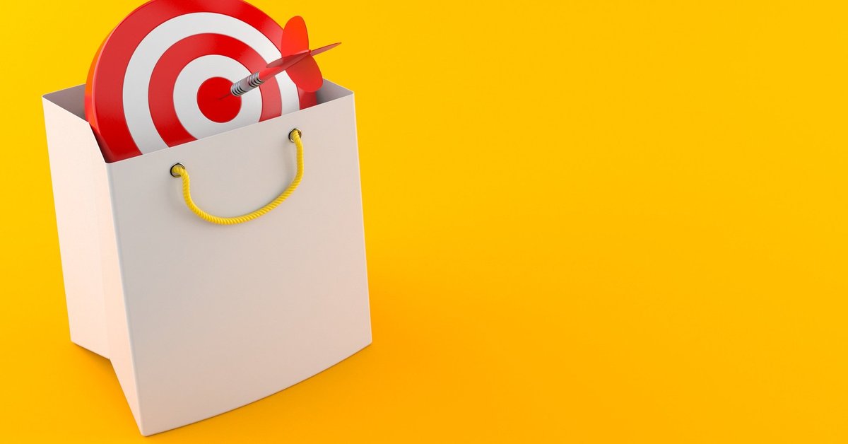 A target in a shopping bag with a dart in the bullseye