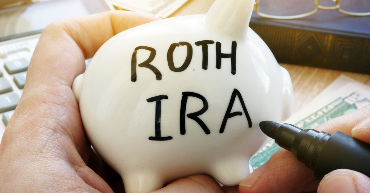 A piggy bank with the words ROTH IRA written on the side.