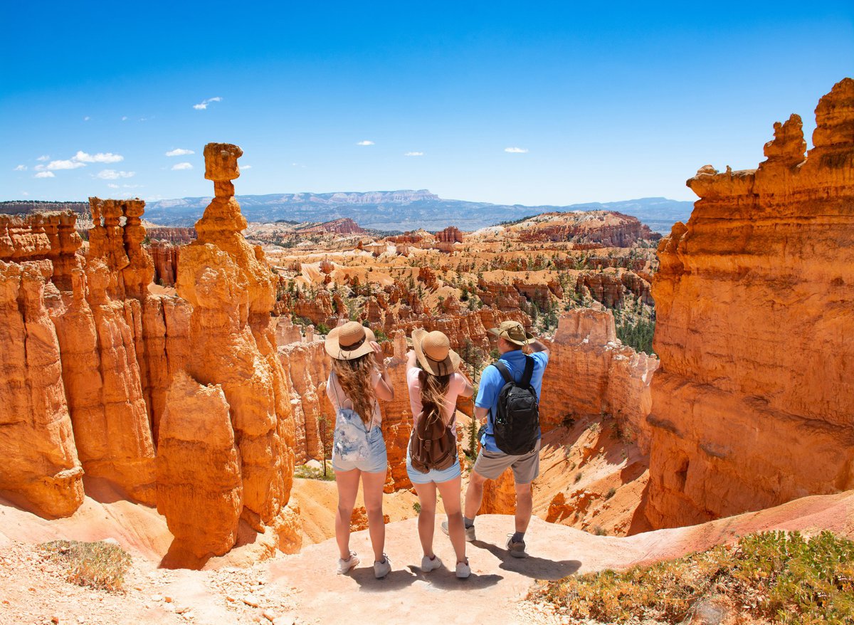 Travelers enjoying scenic rock formations in the desert.
