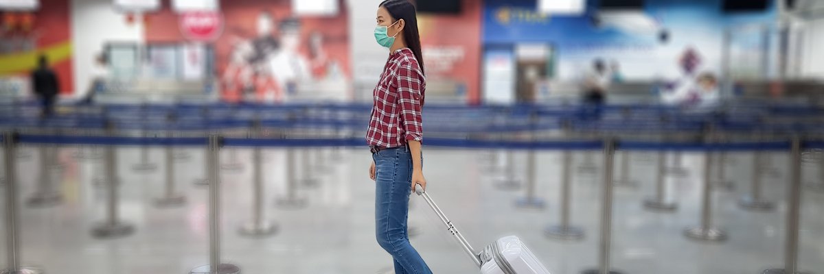 Girl In Mask At Airport
