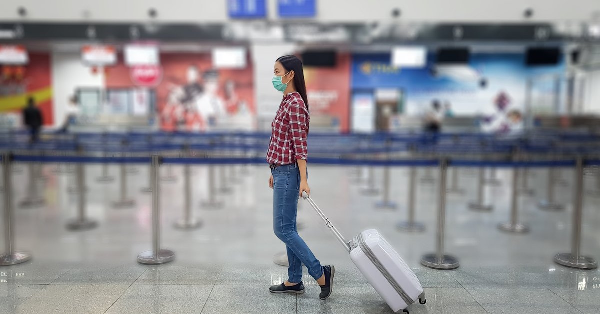 Girl In Mask At Airport