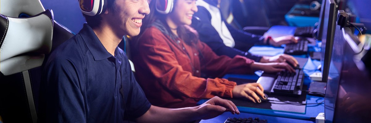 Group of young adults playing computer games together.