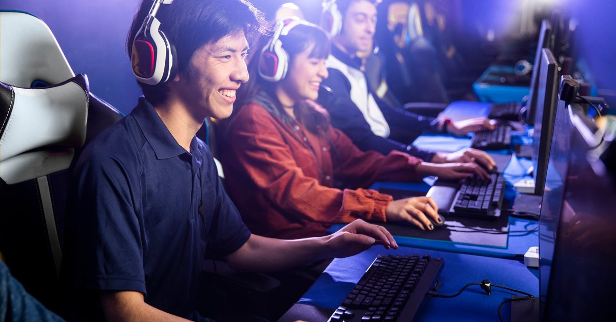 Group of young adults playing computer games together.