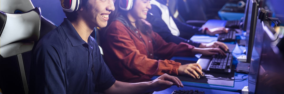 Group of young adults playing computer games together.