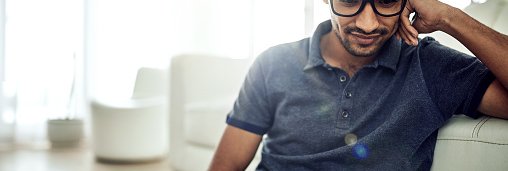Guy With Glasses Looking At Laptop