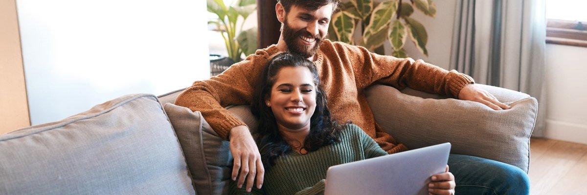 Happy Couple With Laptop