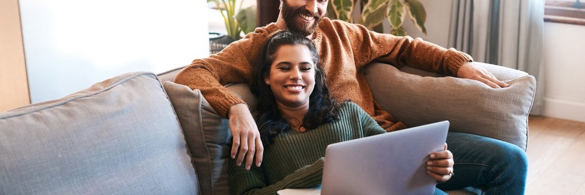 Happy Couple With Laptop