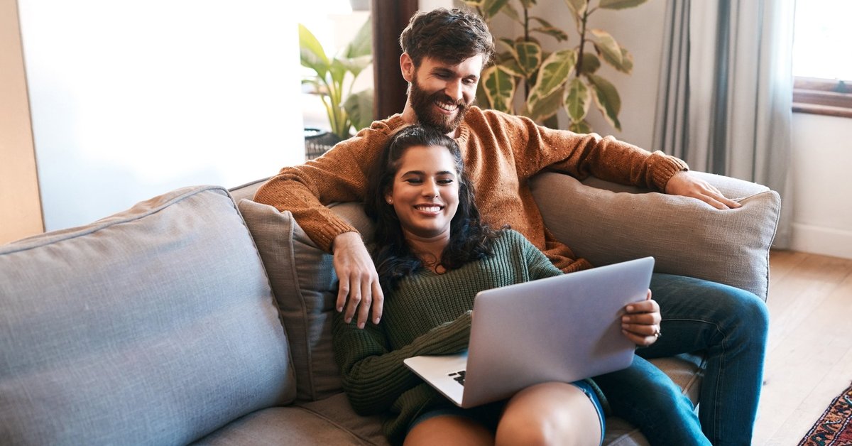 Happy Couple With Laptop