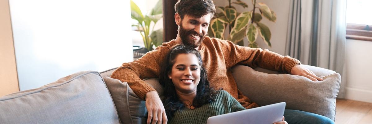 Happy Couple With Laptop
