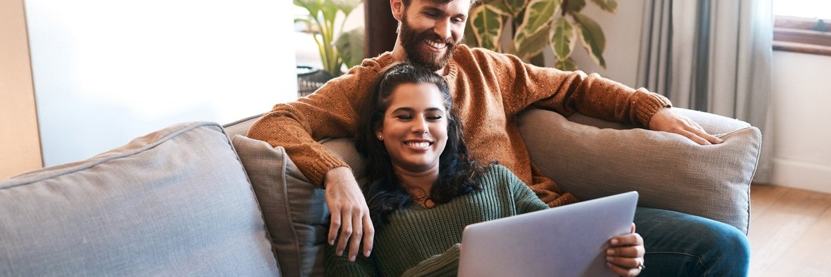 Happy Couple With Laptop