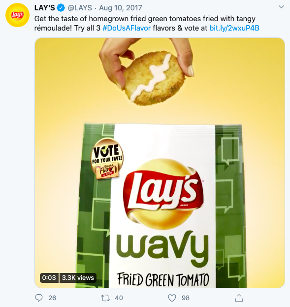 A tweet showing a photo of Lay’s Wavy Fried Green Tomato potato chips with links to a created hashtag and a product poll.