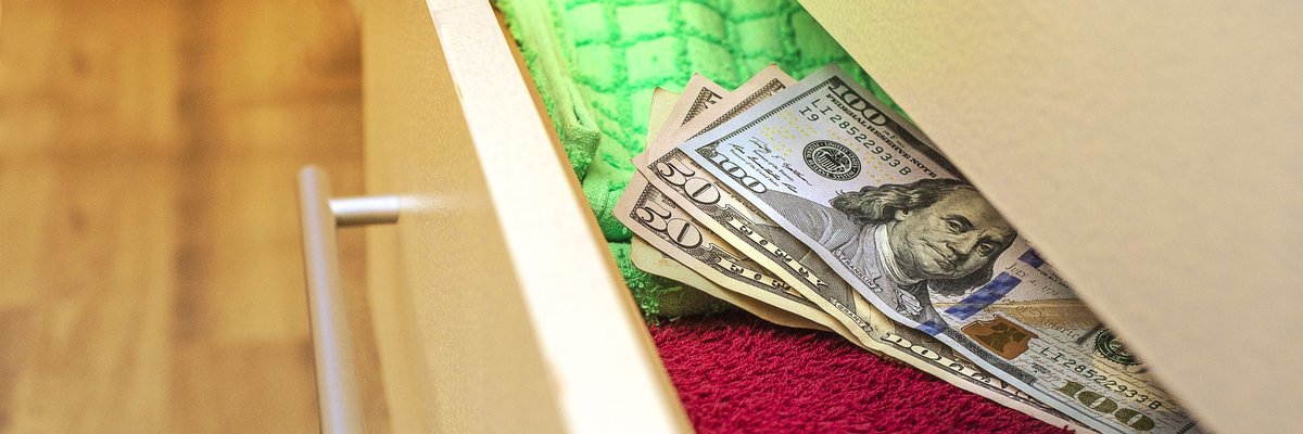 Money hidden in a dresser drawer.
