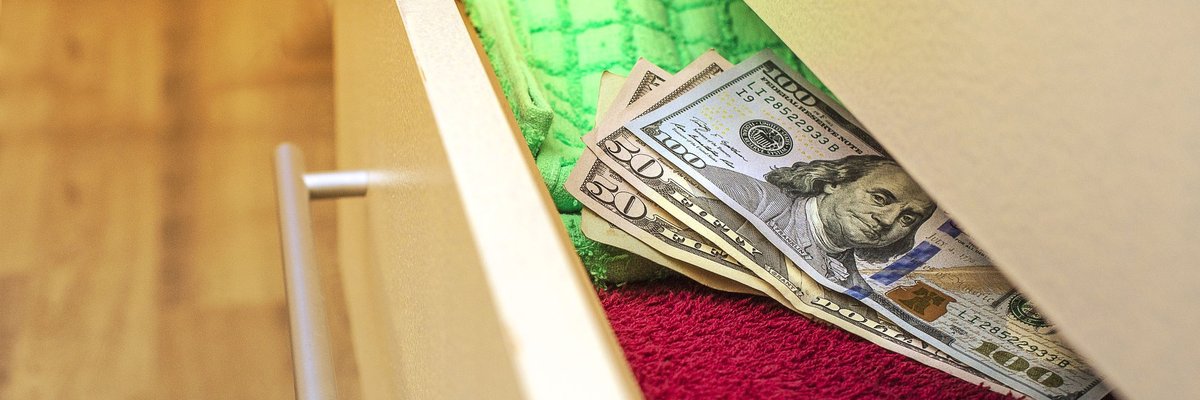 Money hidden in a dresser drawer.