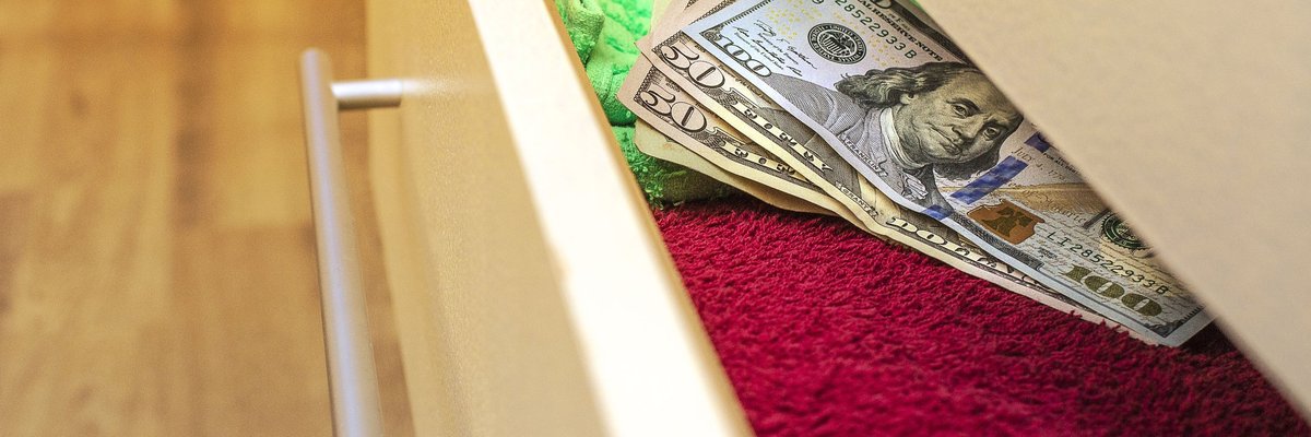 Money hidden in a dresser drawer.