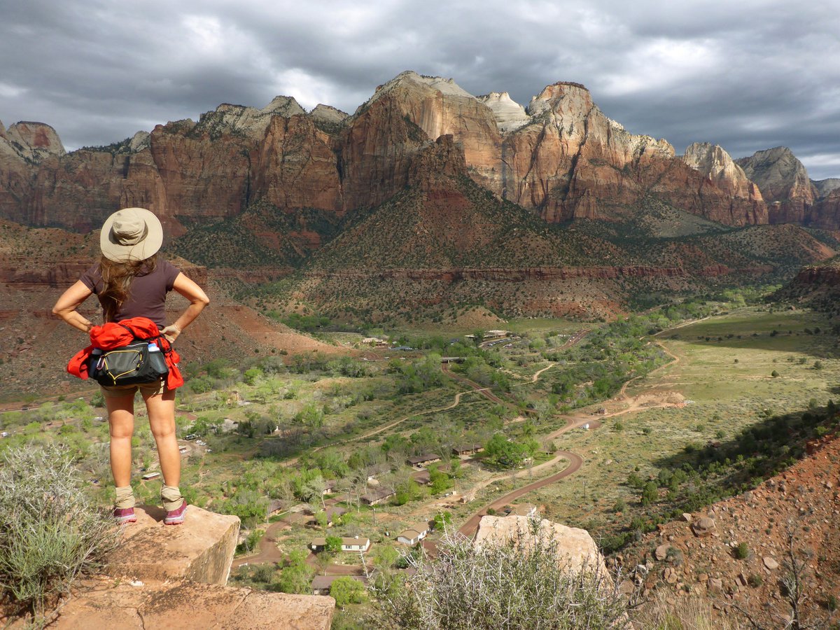 Hiker overlooking view at Zion national park.