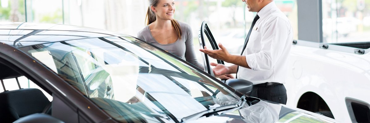 Dealer Showing Female Customer A Car