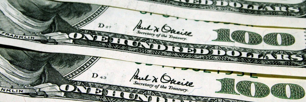 A neat row of hundred dollar bills.