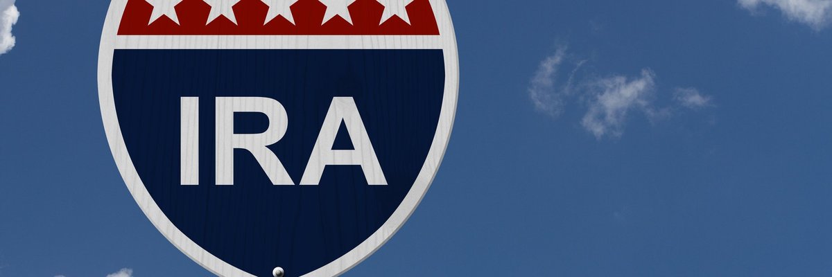 A street sign is labelled IRA with an arrow pointing right.