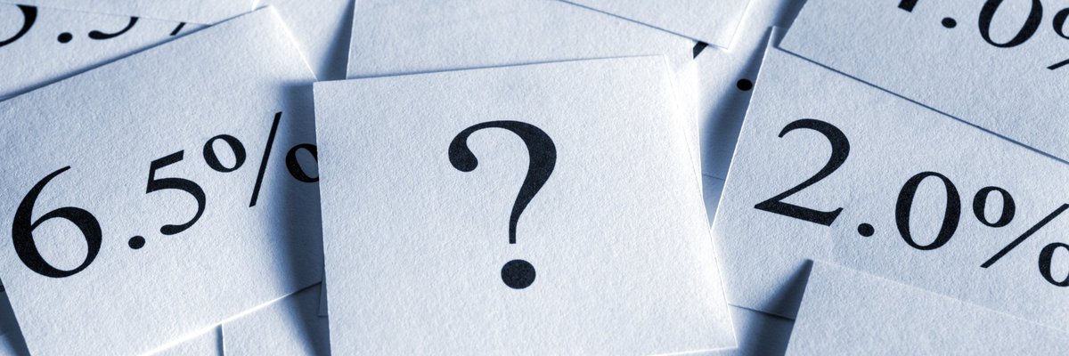 Interest rates and a question mark scattered about on flash cards.