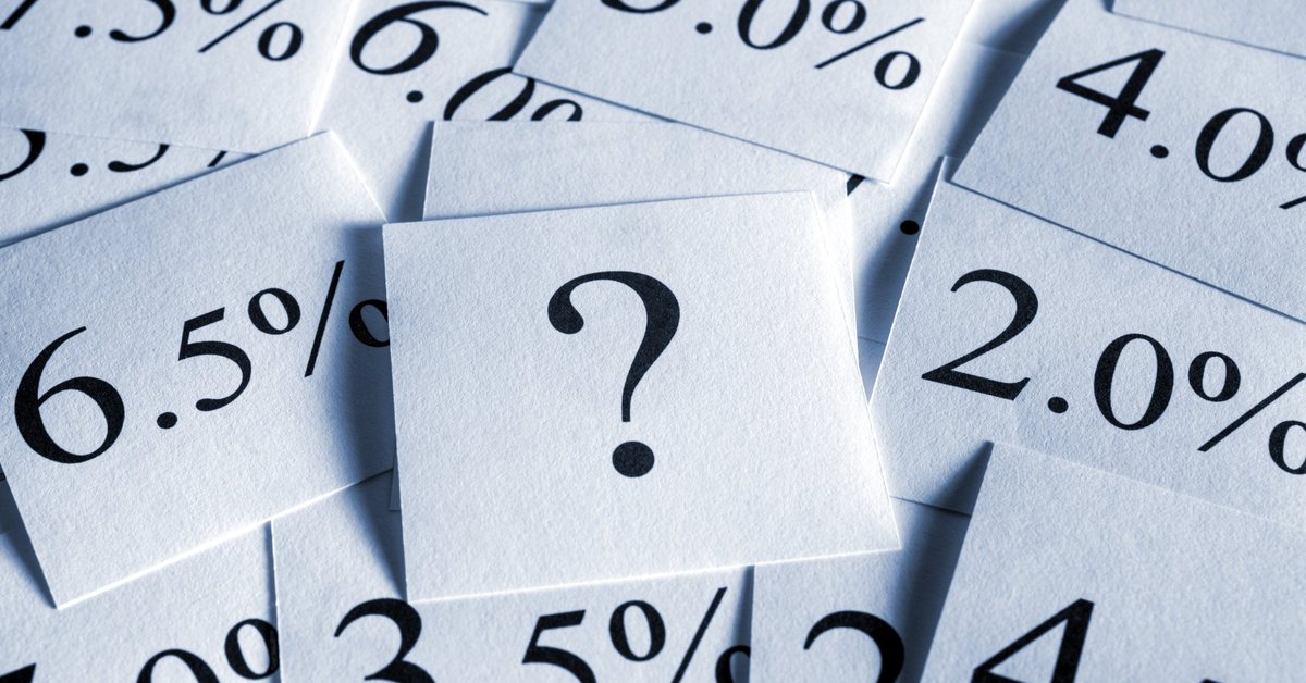 Interest rates and a question mark scattered about on flash cards.